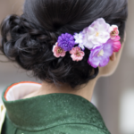 a woman wearing a silk kimono robe